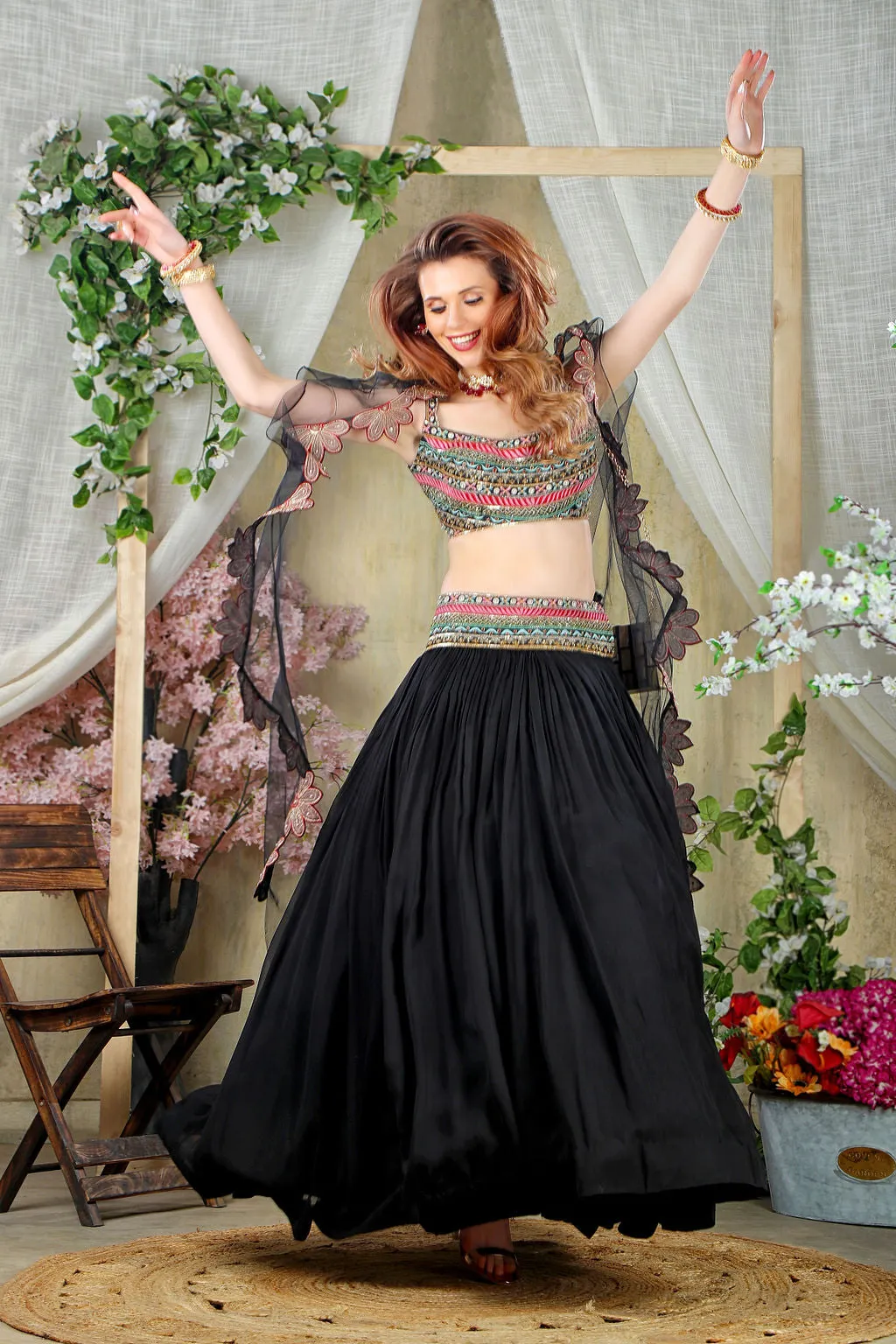 Black embroidered top with matching skirt and cape